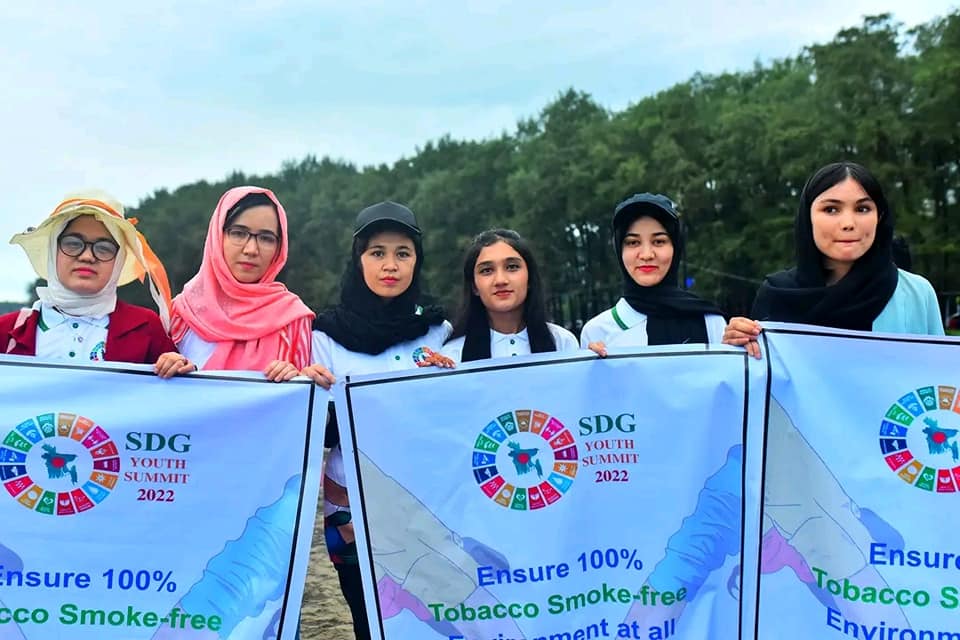 Women holding banners