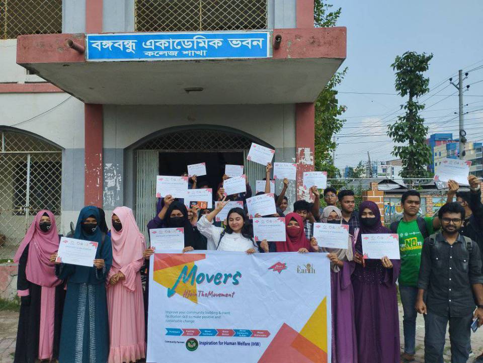 People standing with a paper in their hand
