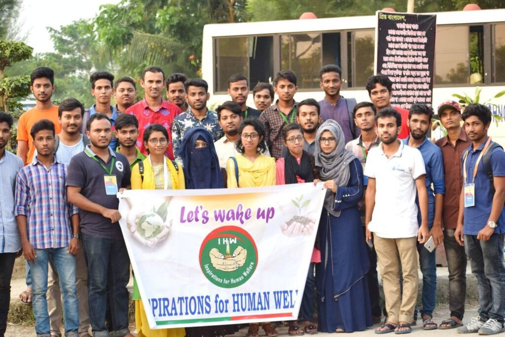 People standing holding a banner